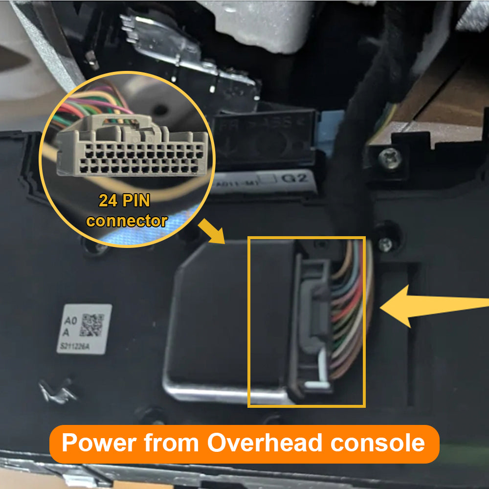 Close-up of a car interior with a 24-pin connector and power from overhead console text.