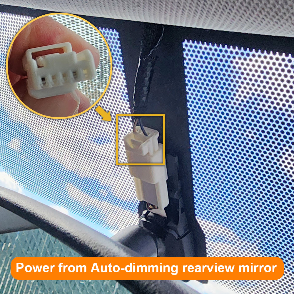 Car with power connection for auto-dimming rearview mirror, close-up of connector.