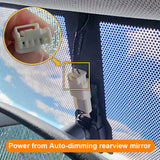 Car with power connection for auto-dimming rearview mirror, close-up of connector.