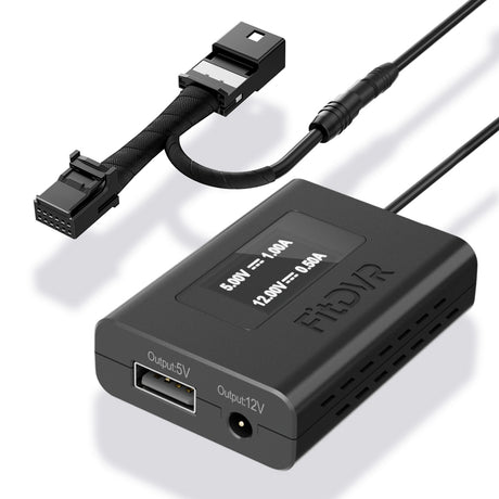 A black FitDVR dash cam power adapter with multiple output ports for USB and DC3.5mm, along with an LED screen displaying voltage information.
