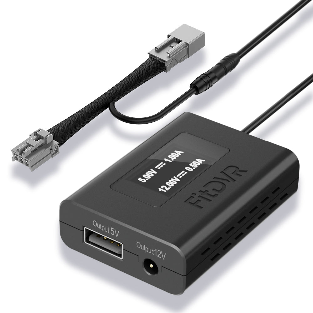 Black electronic power adapter with connectors on a white background