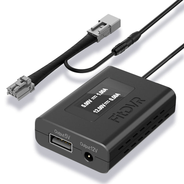 Black electronic power adapter with connectors on a white background