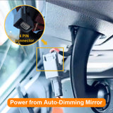 Close-up of a car's interior with a focus on a 4-pin connector and power supply from an auto-dimming mirror.
