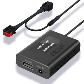 A black fitdvr dash cam power adapter for Land Rover, Jaguar vehicles with auto-dimming rearview mirror. The device has a USB and a 3.5mm DC output