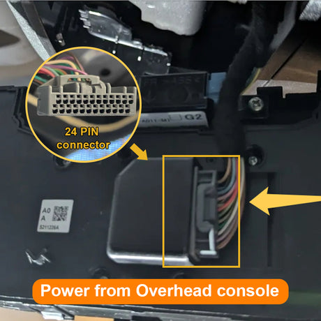 Close-up of a car interior with a 24-pin connector and power from overhead console text.